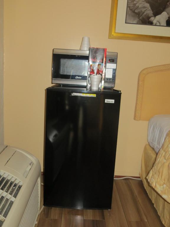 Postel nebo postele na pokoji v ubytování El Trovatore Motel