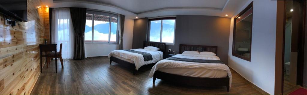 Postel nebo postele na pokoji v ubytování Cat Cat View Hotel