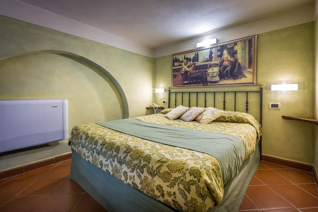Postel nebo postele na pokoji v ubytování Il Borgo di Villa Castelletti Country Hotel