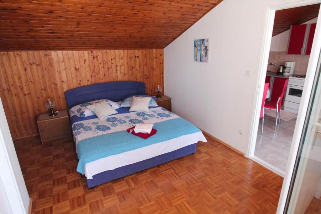 Postel nebo postele na pokoji v ubytování Apartment Vatrogasac