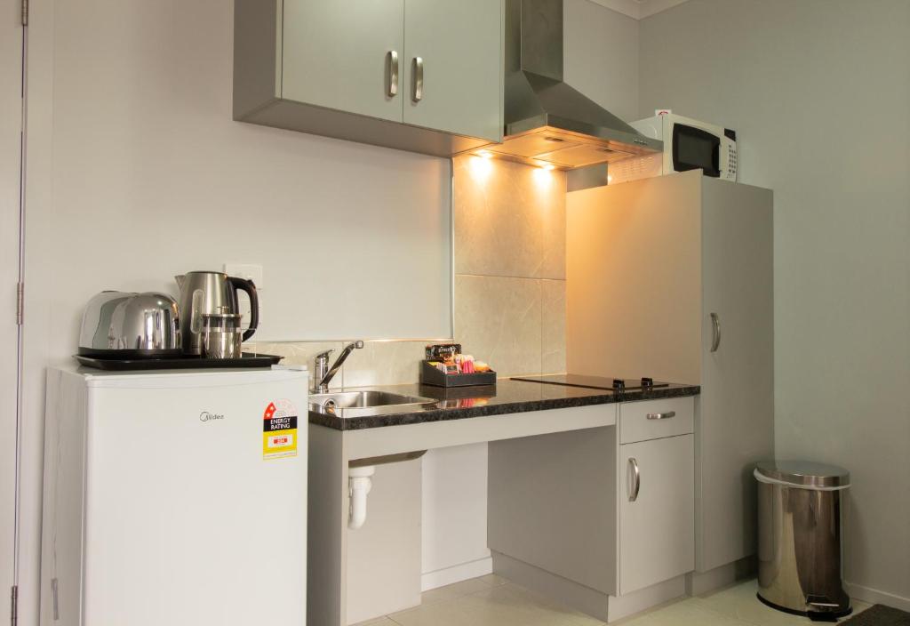 Kuchyň nebo kuchyňský kout v ubytování BKs Premier Motel Esplanade