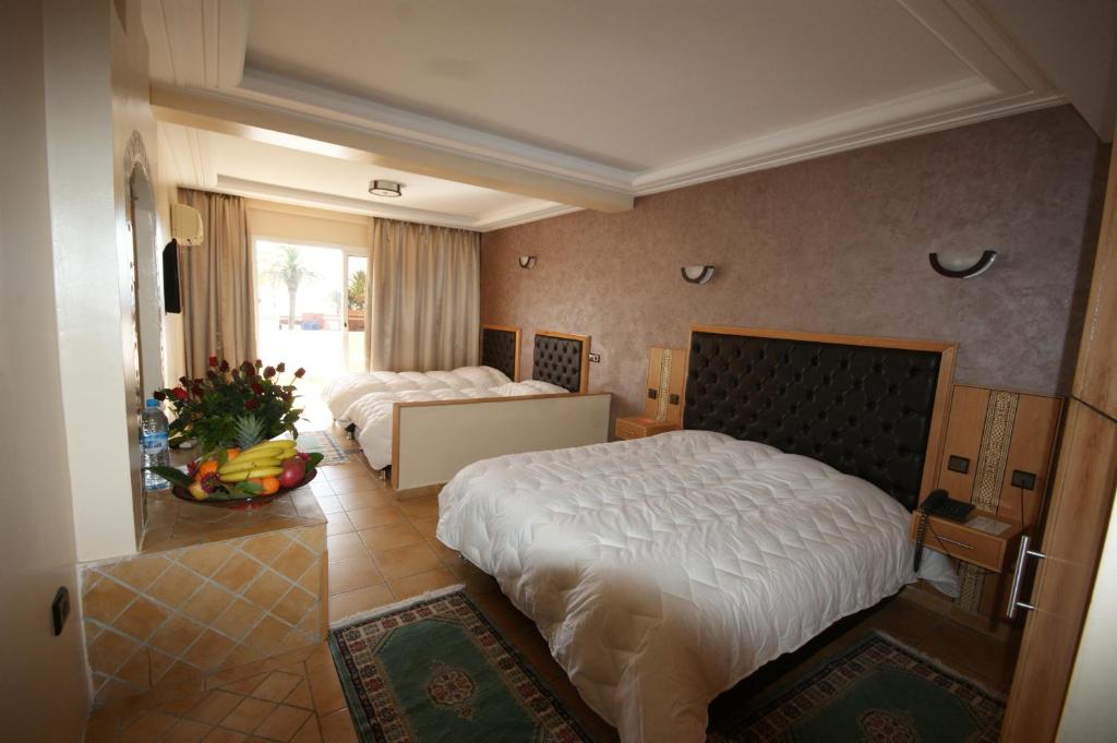Postel nebo postele na pokoji v ubytování Hotel Club Almoggar Garden Beach