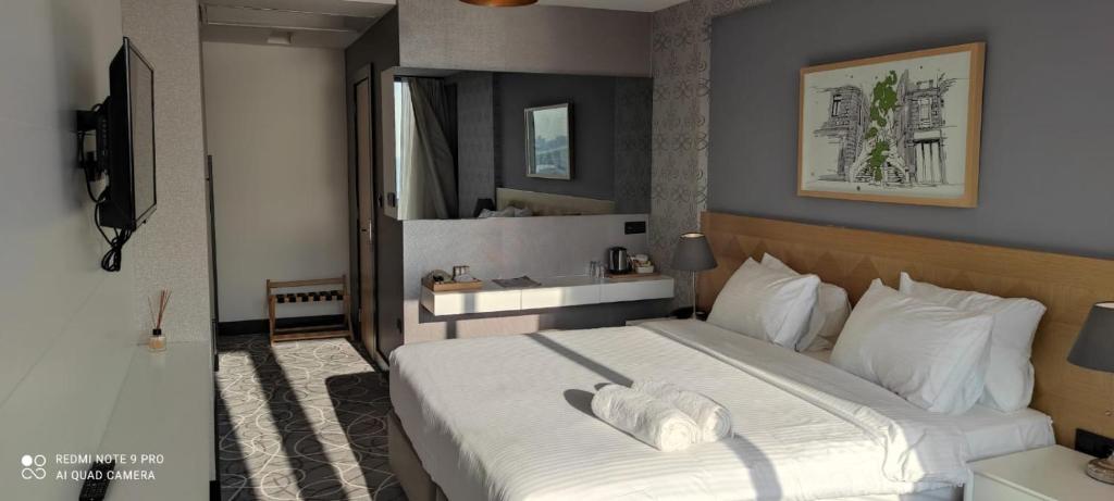 TV a/nebo společenská místnost v ubytování Four-G Hotel