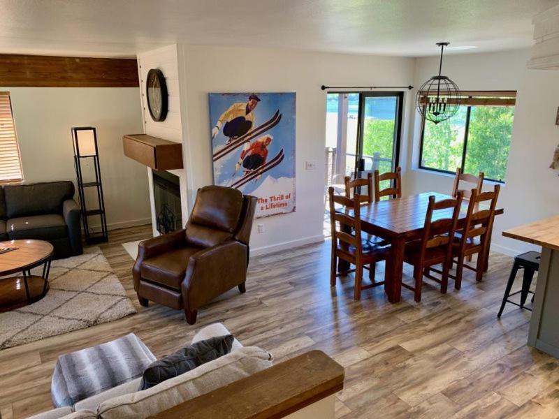 a living room with a couch and a table and chairs at Rr-edgewater04 in June Lake