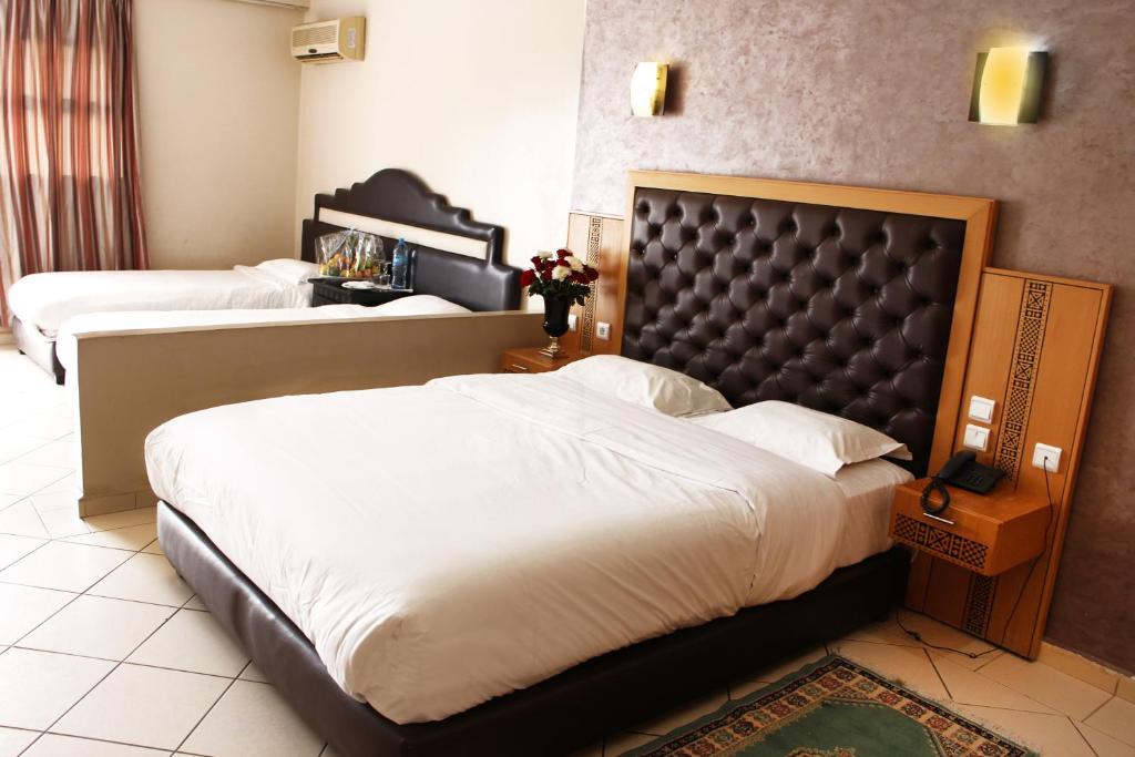 Postel nebo postele na pokoji v ubytování Hotel Club Almoggar Garden Beach