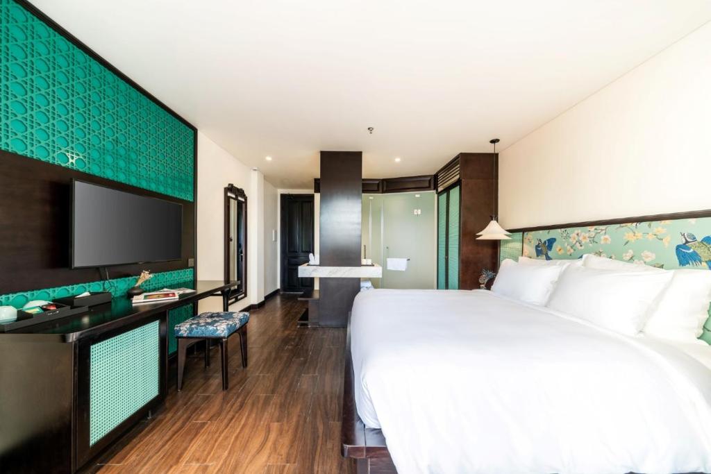 Postel nebo postele na pokoji v ubytování De An Hotel