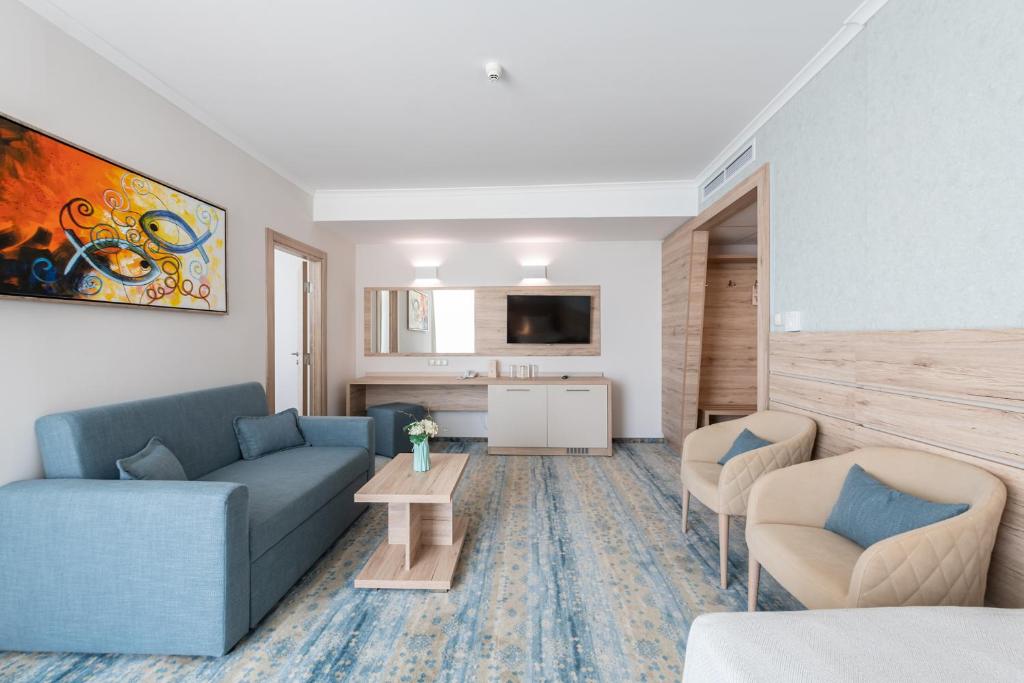 TV a/nebo společenská místnost v ubytování Hotel Neptun Beach