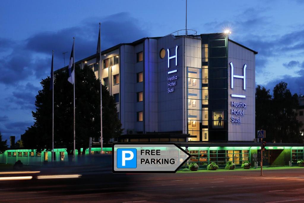 a free parking sign in front of a building at Hestia Hotel Susi in Tallinn