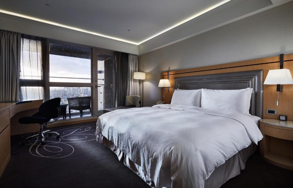 Postel nebo postele na pokoji v ubytování K Hotel Taipei Songjiang