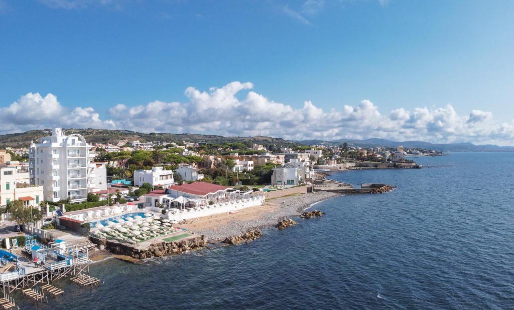 an aerial view of a resort on the water at Hotel Cavalluccio Marino in Santa Marinella