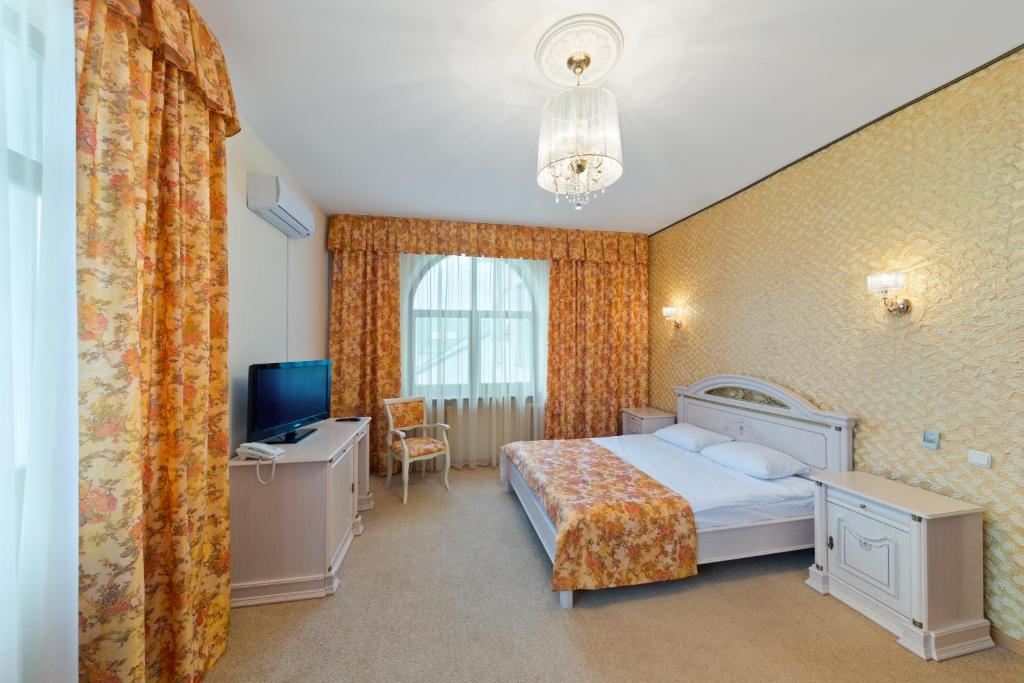 Posteľ alebo postele v izbe v ubytovaní Versal Hotel