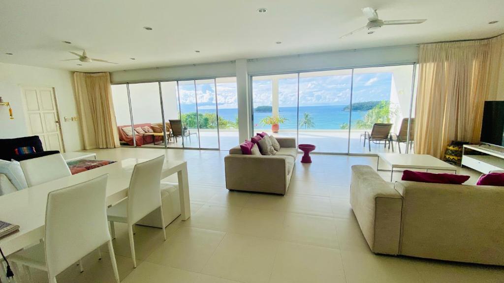 a living room with a view of the ocean at Kata Top Villas in Kata Beach