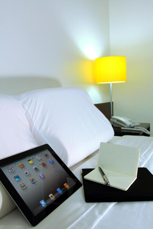 Postel nebo postele na pokoji v ubytování Go Hotels Plus Mandaluyong