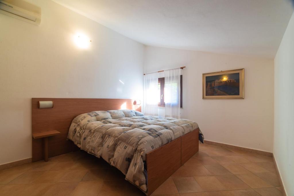 Een bed of bedden in een kamer bij Bonsai B&B Alghero