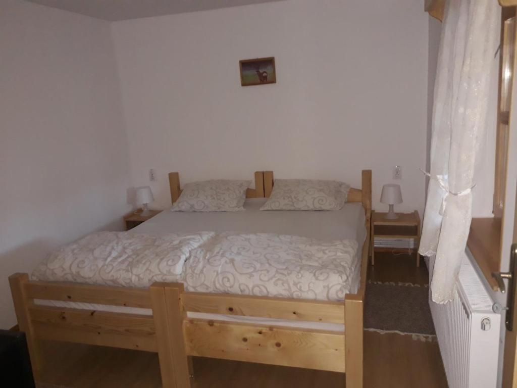 Postel nebo postele na pokoji v ubytování Rita Apartman & Studio