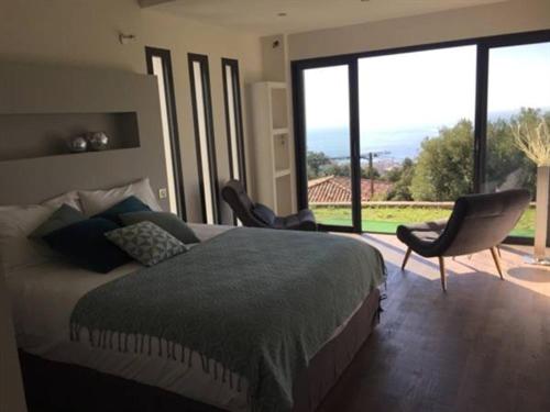 Postel nebo postele na pokoji v ubytování Maison d'hôtes Bastia