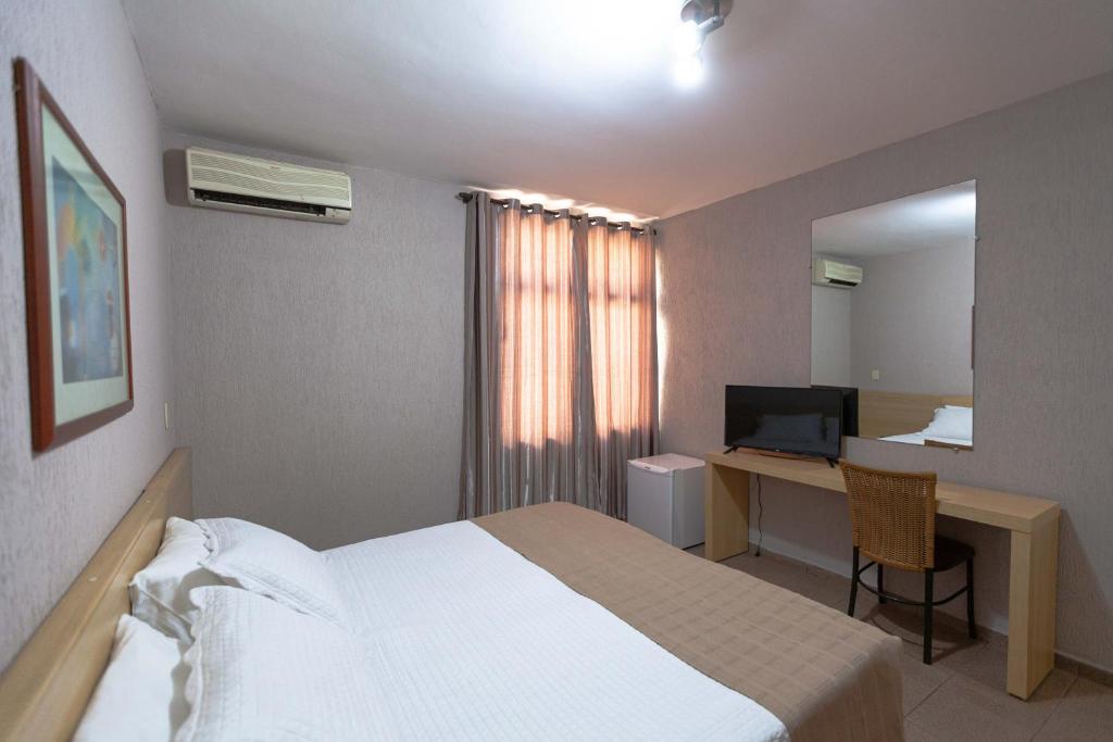 Postel nebo postele na pokoji v ubytování Hotel Foz do Iguaçu