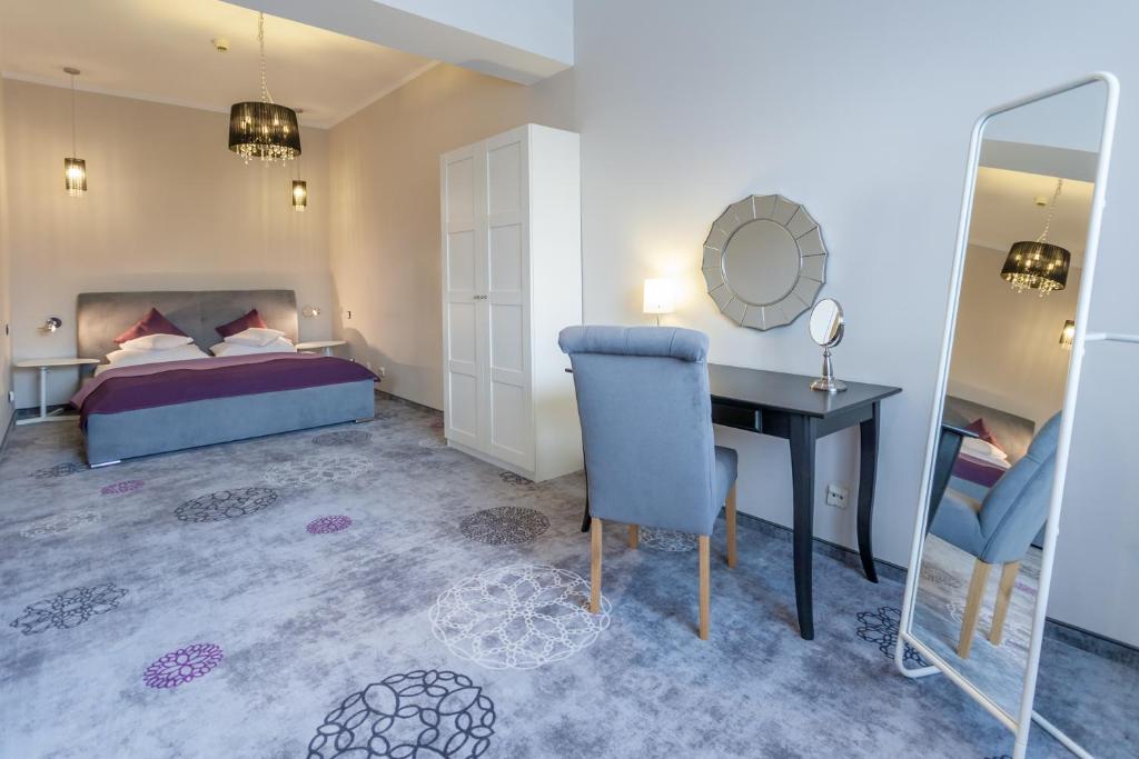 Postel nebo postele na pokoji v ubytování Hotel Mikulski