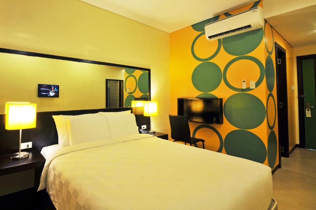 Postel nebo postele na pokoji v ubytování Go Hotels Iloilo