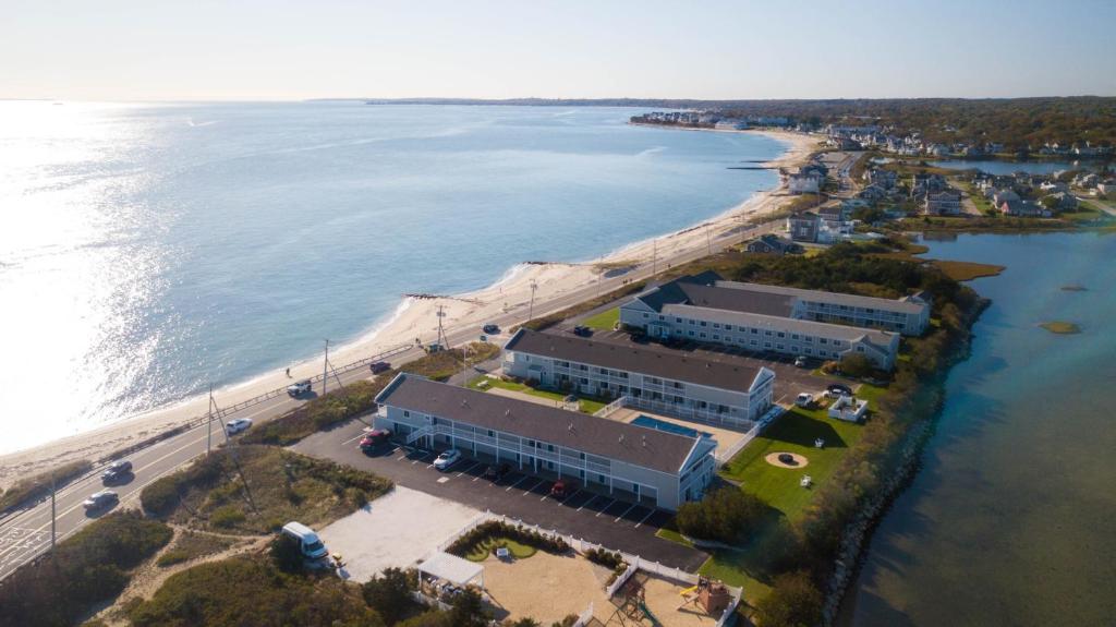 an aerial view of a building next to a beach at InnSeason Resorts Surfside in Falmouth