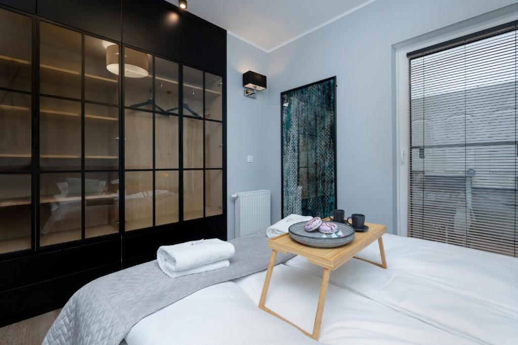 Posteľ alebo postele v izbe v ubytovaní Exclusive Apartments Mostowa by Renters Prestige