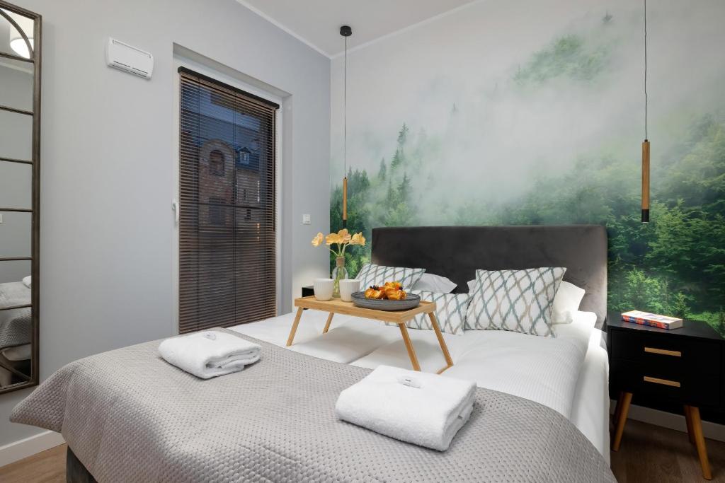 Posteľ alebo postele v izbe v ubytovaní Exclusive Apartments Mostowa by Renters Prestige