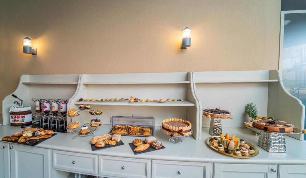a buffet with many different types of bread and pastries at Hotel Colomba D'Oro in Tropea