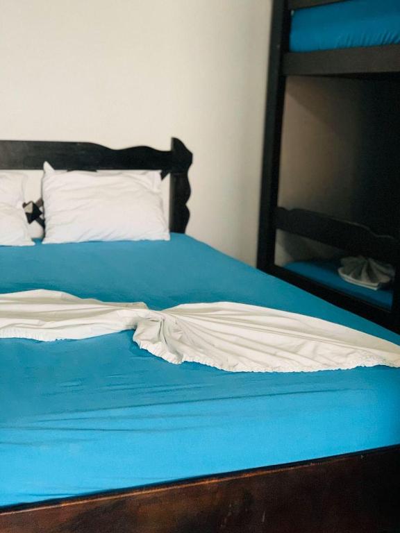 Postel nebo postele na pokoji v ubytování Hostel Tortuguero 7BackPackers
