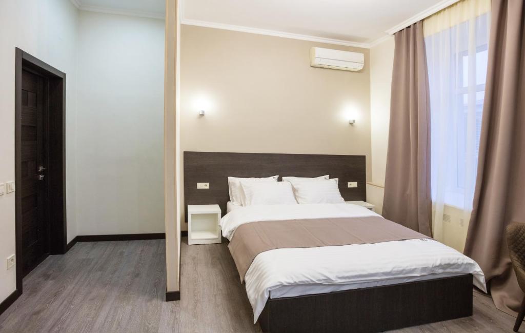 Postel nebo postele na pokoji v ubytování Khreshchatyk Apart Hotel Passage