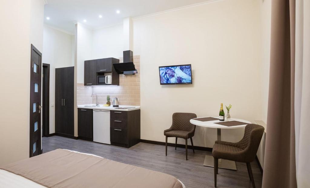 Kuchyň nebo kuchyňský kout v ubytování Khreshchatyk Apart Hotel Passage