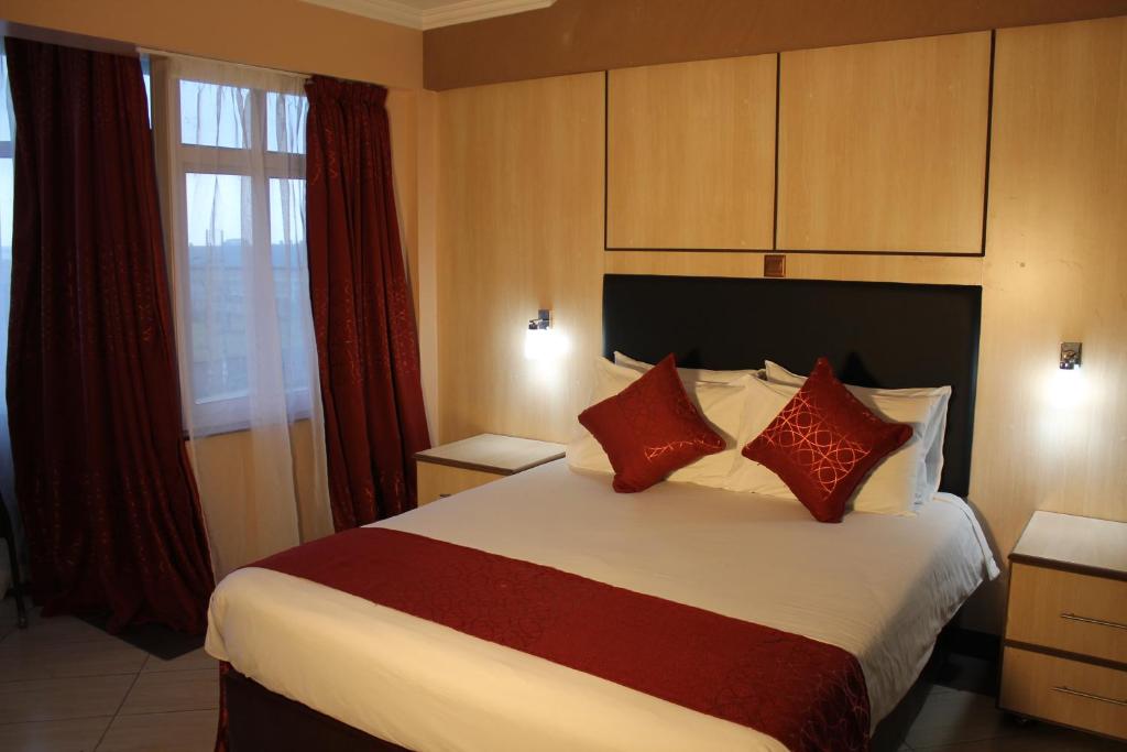 Postel nebo postele na pokoji v ubytování Airport Landing Hotel