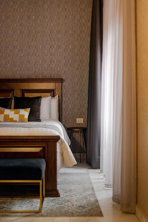 Postel nebo postele na pokoji v ubytování Hotel Boutique Casa Zevallos
