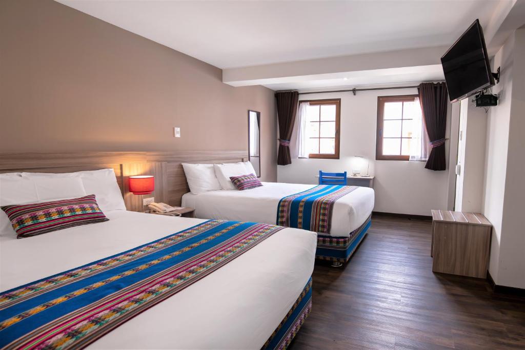 Postel nebo postele na pokoji v ubytování Atoq San Blas Hotel