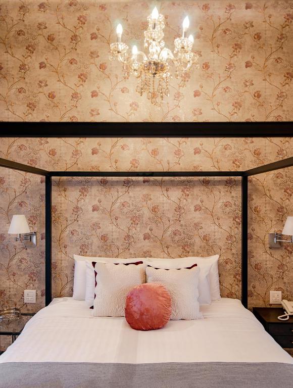 Postel nebo postele na pokoji v ubytování Hotel Boutique Casa Zevallos
