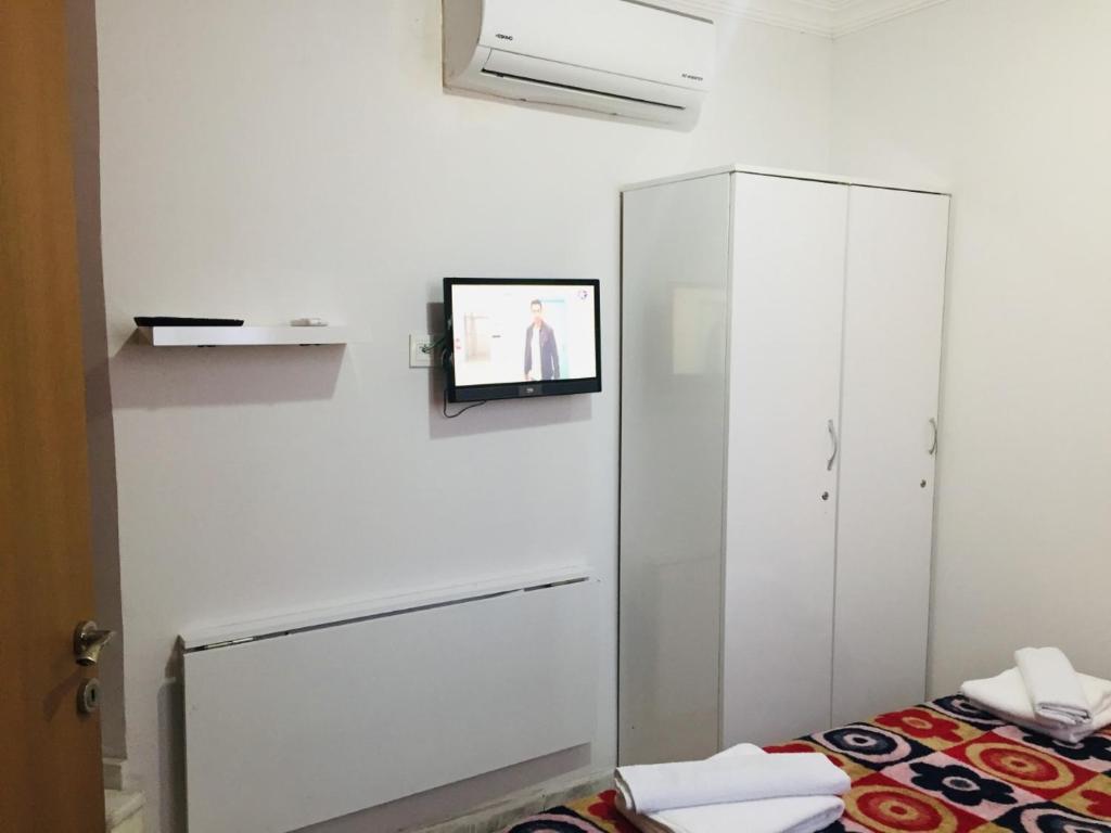 Postel nebo postele na pokoji v ubytování Şato Apart Hotel
