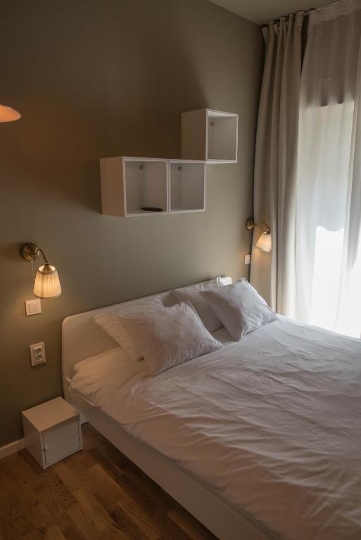 Łóżko lub łóżka w pokoju w obiekcie S&L1 REPUBLIC ZAGREB CENTER
