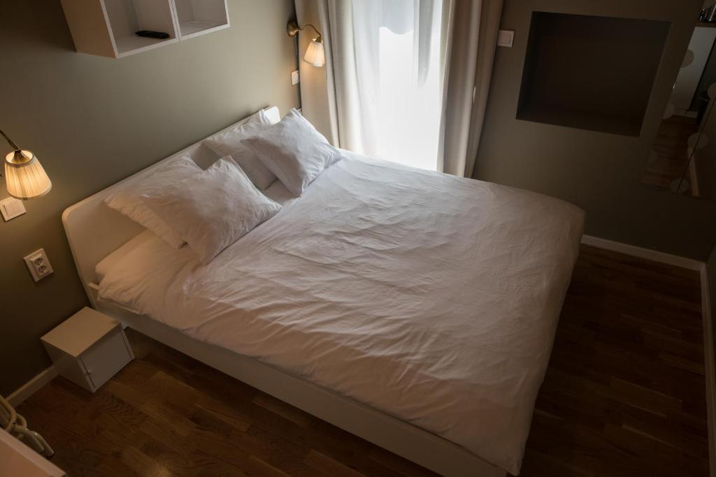 Łóżko lub łóżka w pokoju w obiekcie S&L1 REPUBLIC ZAGREB CENTER