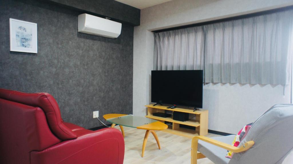 TV a/nebo společenská místnost v ubytování Compass