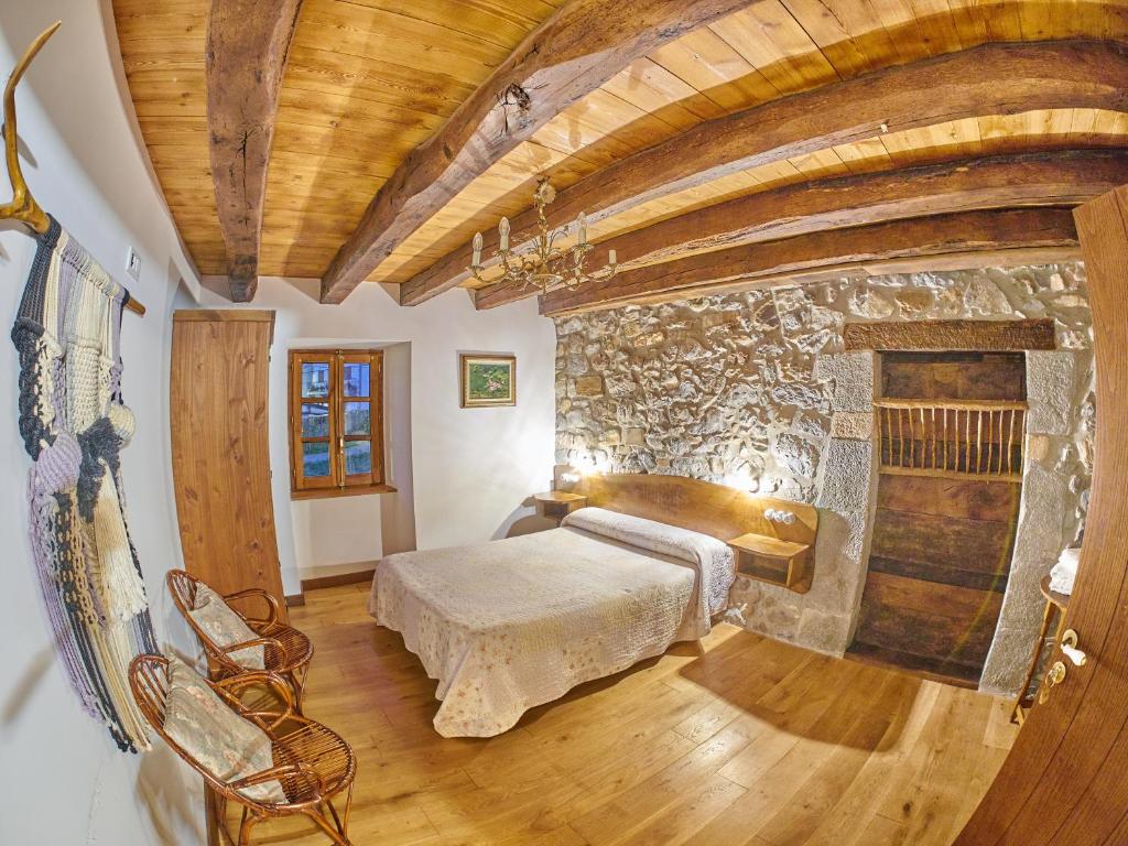 Postel nebo postele na pokoji v ubytování Casa Rural Lenco