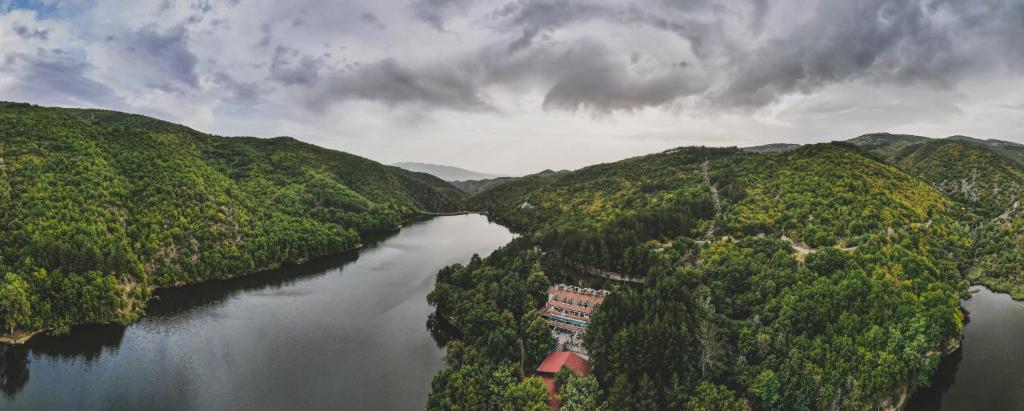 an aerial view of a river in a forest at Euro Hotel Gradche in Kočani