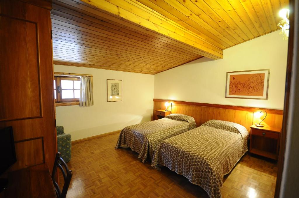 Letto o letti in una camera di Hotel 2 Camini