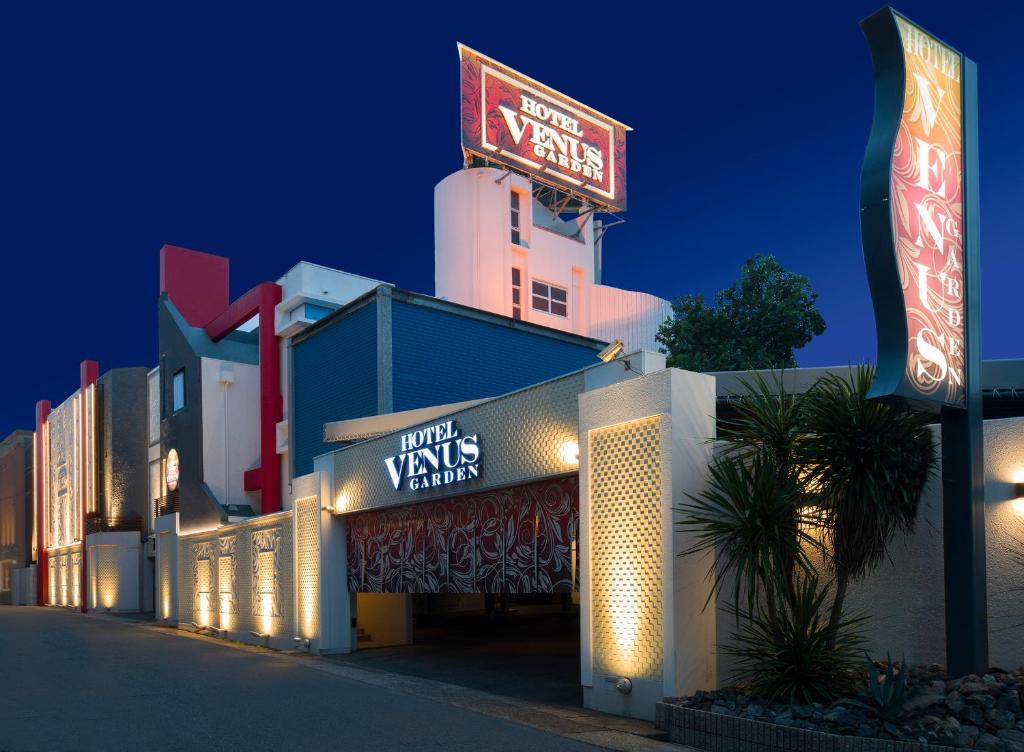 a hotel with neon signs on the side of a building at Hotel Venus Garden(Adult Only) in Nagoya