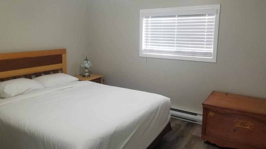 Postel nebo postele na pokoji v ubytování Sandy Beach Suites