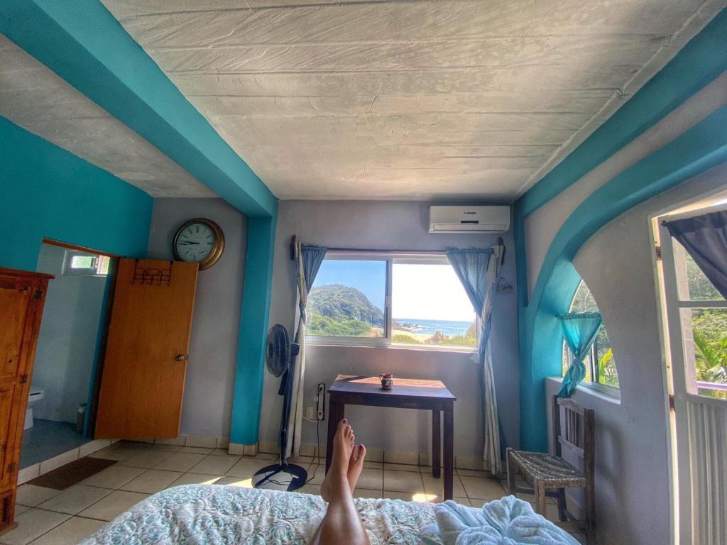 Postel nebo postele na pokoji v ubytování Colibri Hotel