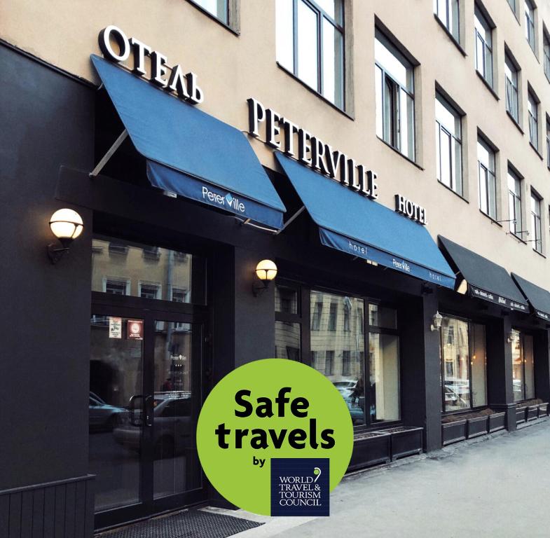 a store with a sign that reads safe travels at Peterville in Saint Petersburg