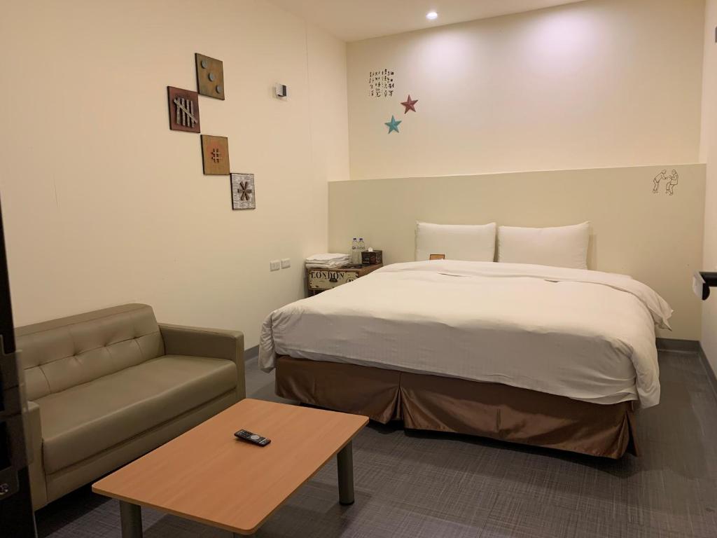 Postel nebo postele na pokoji v ubytování Skyone Hotel