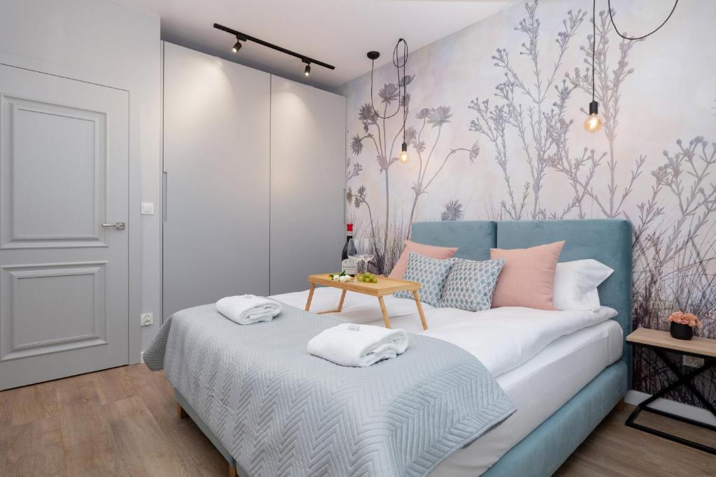 Posteľ alebo postele v izbe v ubytovaní Exclusive Apartments Mostowa by Renters Prestige