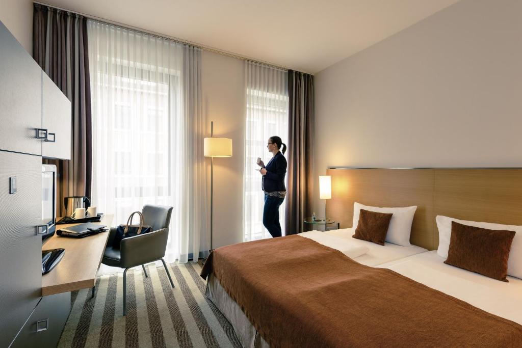 Postel nebo postele na pokoji v ubytování Mercure Hotel Aachen Am Dom