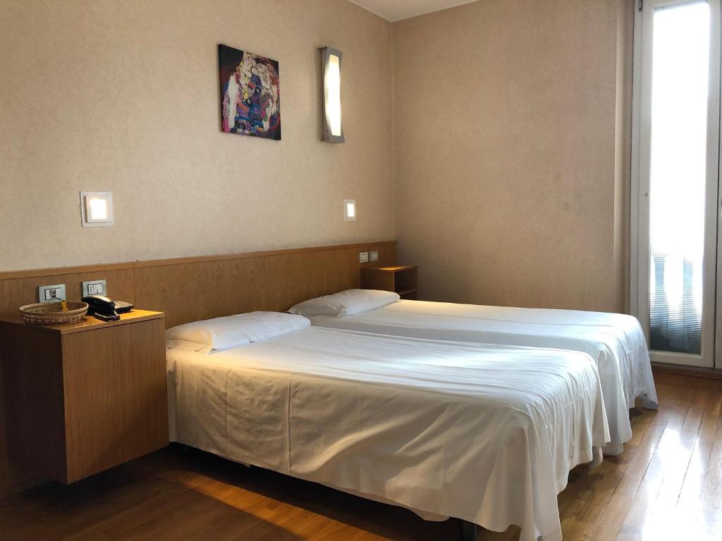 Łóżko lub łóżka w pokoju w obiekcie Eurohotel
