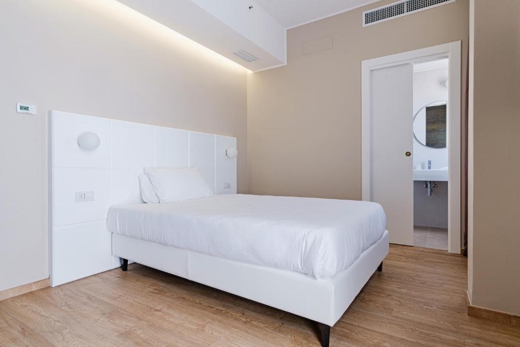 Postel nebo postele na pokoji v ubytování Hotel Boston